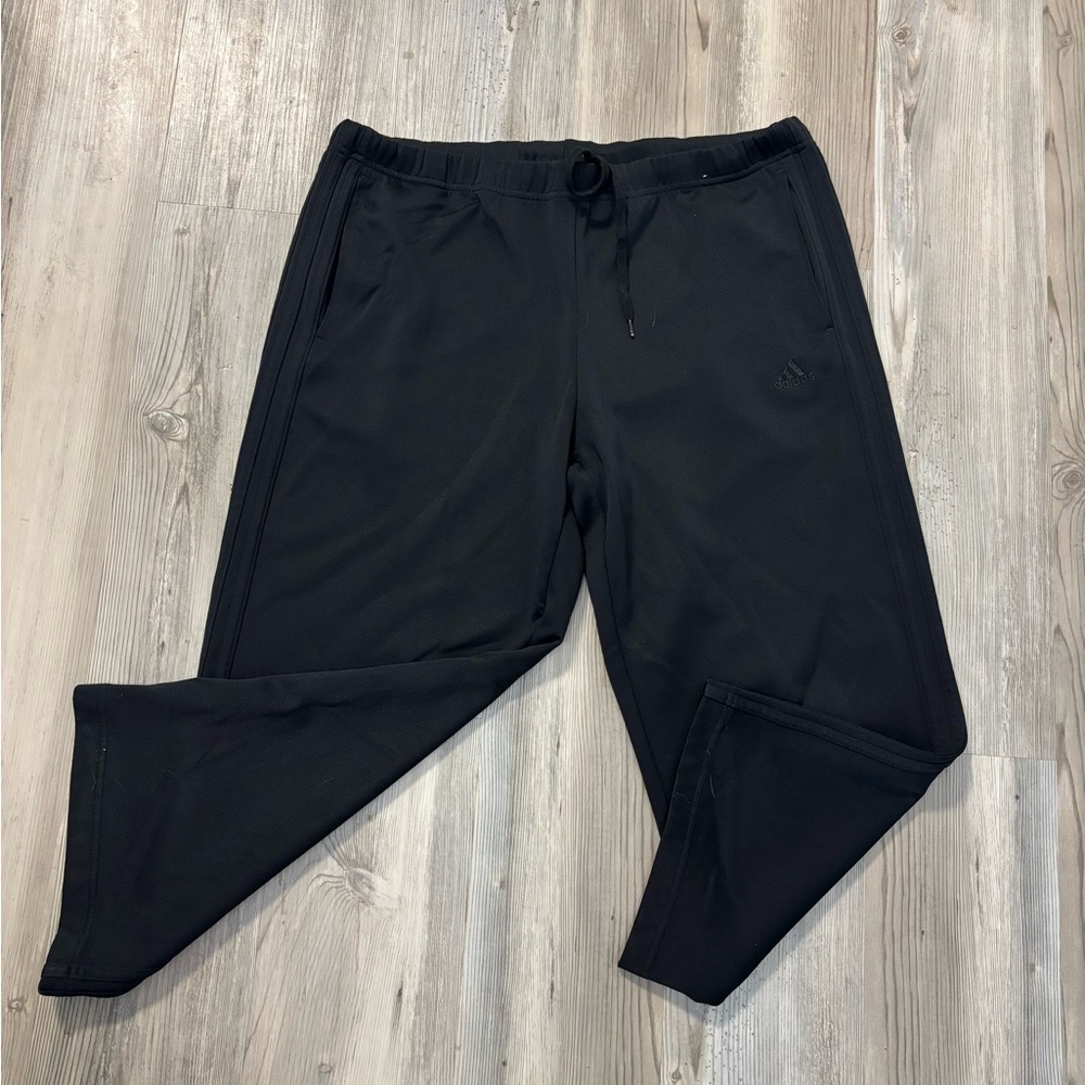 Adidas black ankle length size oversized medium adjustable waist inseam is 24
